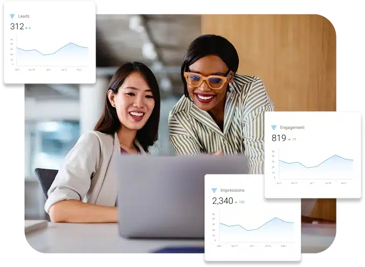 Do It With Me Two women looking at laptop reviewing website performance